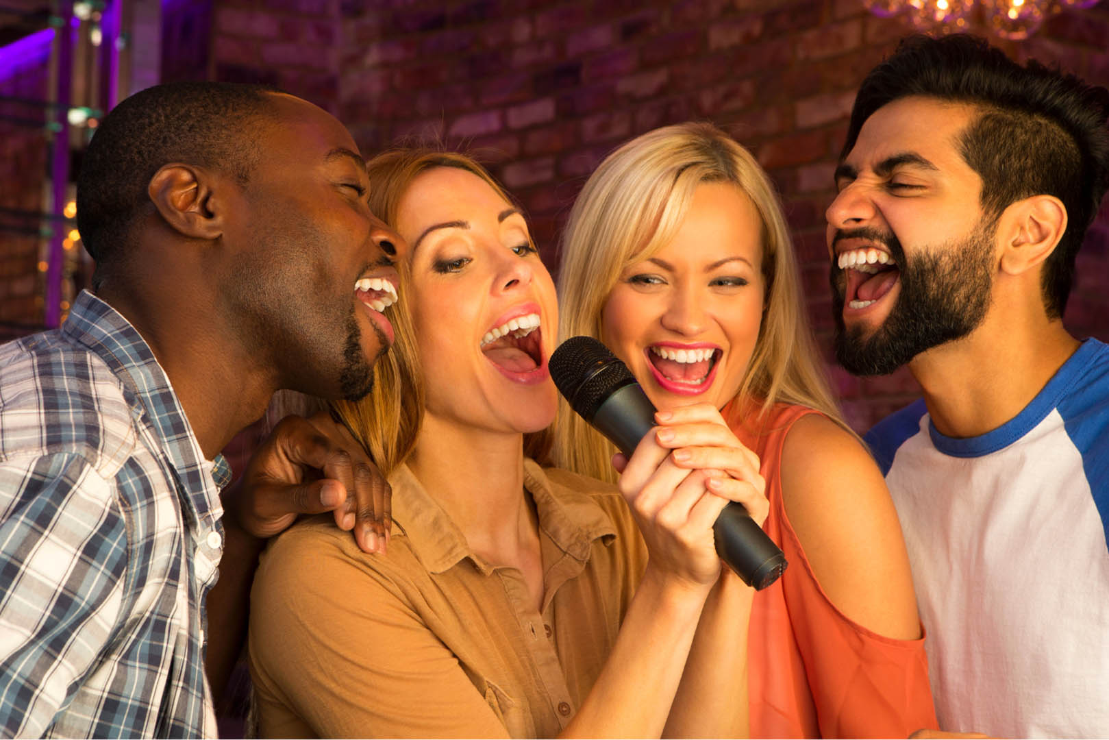 4 people doing karaoke 