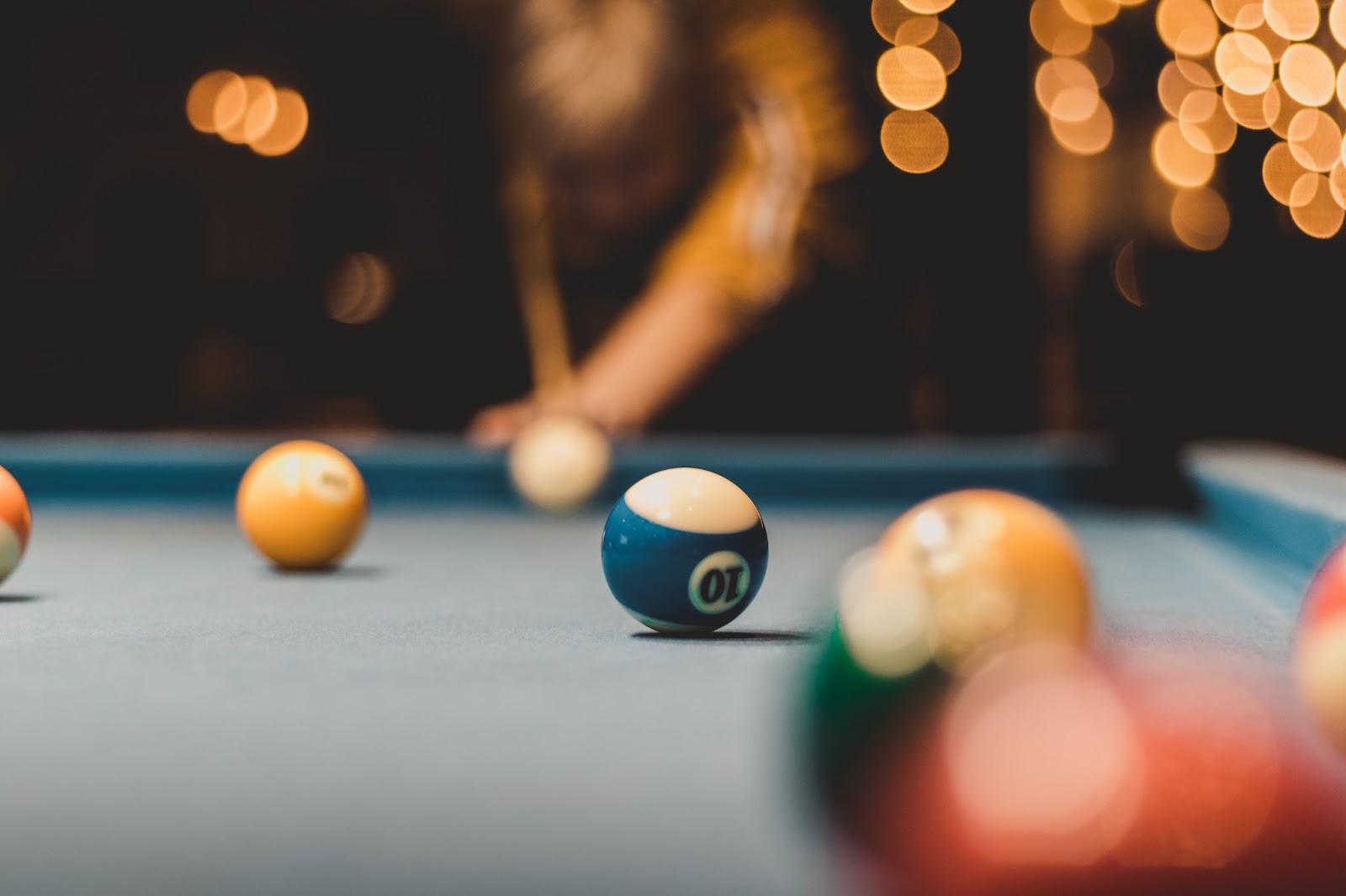Pool table with lights in background